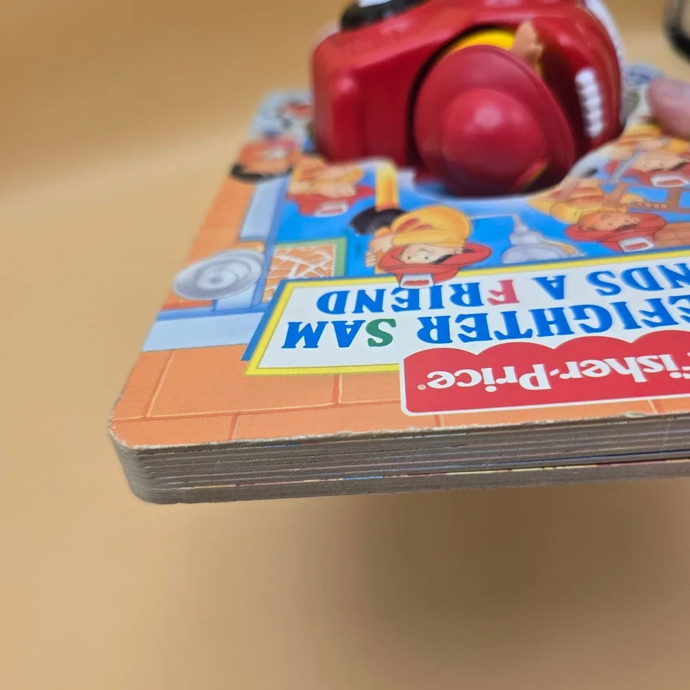Fisher-Price Little People Firefighter Sam Finds a Friend Board Book Toy 1997